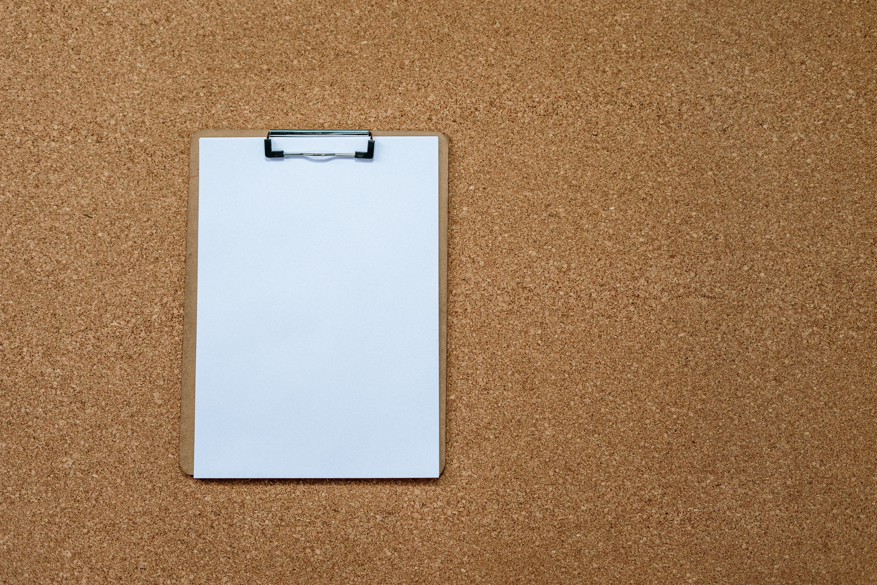 White Rectangular Board on Brown Surface